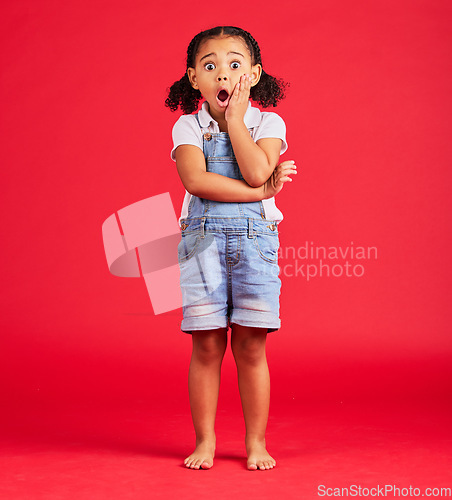 Image of Little girl, portrait or shocked hand on face, isolated or red background and kids gossip, bad news or scary children story. Surprised, anxiety or scared kid in horror facial expression, wow or emoji