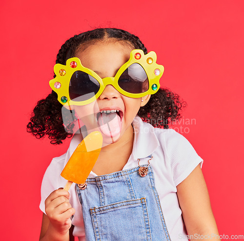 Image of Child, sunglasses or ice cream on isolated red background or tongue, cool or summer fashion clothes. Happy, kid or girl with lolly, cold sweet or funny glasses for sun protection during fun vacation