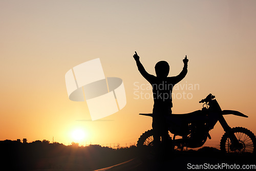 Image of Motorcycle, silhouette and sunset with a sports man outdoor, arms raised in celebration for freedom with mockup. Sky, nature and motorbike with a male rider outside celebrating on a road trip