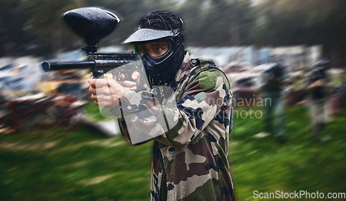 Image of Man, paintball or gun aim in motion blur games arena or challenge in teamwork competition, sports or military training. Player, rifle or shooting equipment for soldiers, fast army or battlefield war