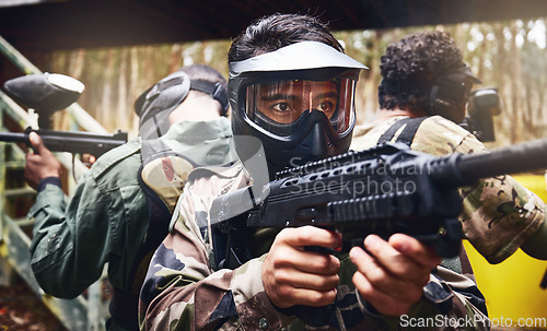 Image of Men, teamwork or paintball gun in games arena, competition or sports challenge in military uniform. Soldiers, army or people and shooting paint equipment in warfare training or battlefield protection