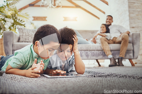 Image of Tablet, children on carpet and family relax on sofa for home internet, elearning development app or online games. Kids on ground or floor and digital technology for youth website and parents on couch