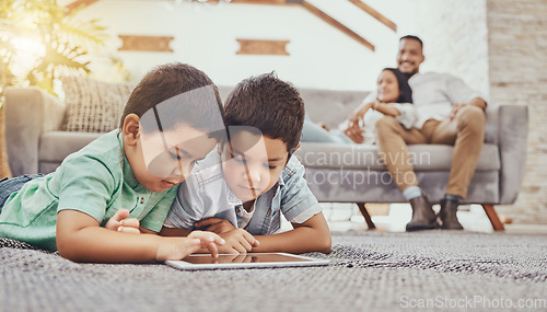 Image of Children with tablet, games or streaming with parents at family home, gaming with technology or video watching. Internet, wifi and childhood, mother and father relax with boys and screen time