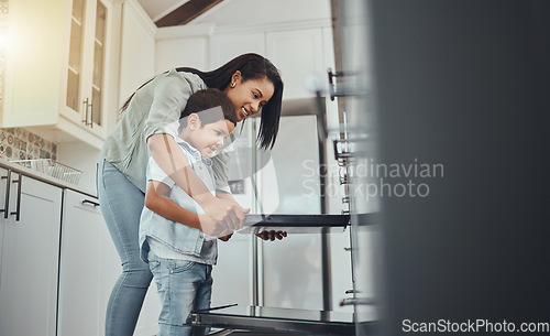 Image of Baking, fun and child helping mother with food, cooking and learning by the oven in the kitchen. Breakfast, happy and mom and boy kid making lunch, dinner or a snack together in their family home