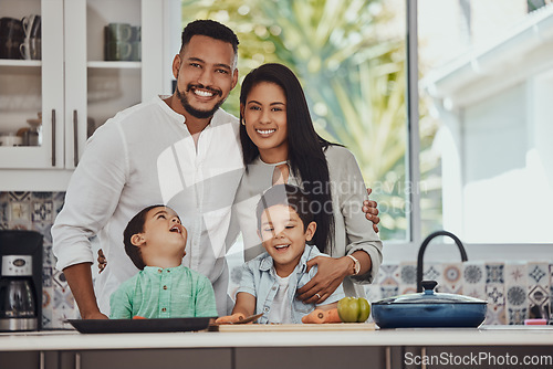 Image of Cooking, happy and portrait of family in kitchen for health, nutrition and diet wellness. Smile, bonding and food with parents and children at home with vegetables for learning, growth and help