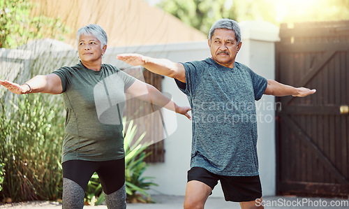 Image of Exercise, yoga and health with a senior couple outdoor in their garden for a workout during retirement. Fitness, pilates and lifestyle with a mature man and woman training together in their backyard