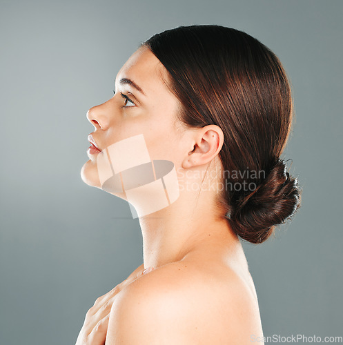 Image of Woman, beauty and facial profile in studio for skincare, wellness and cosmetics. Young female model, face side and dermatology for aesthetic makeup, healthy shine and natural glow from salon results