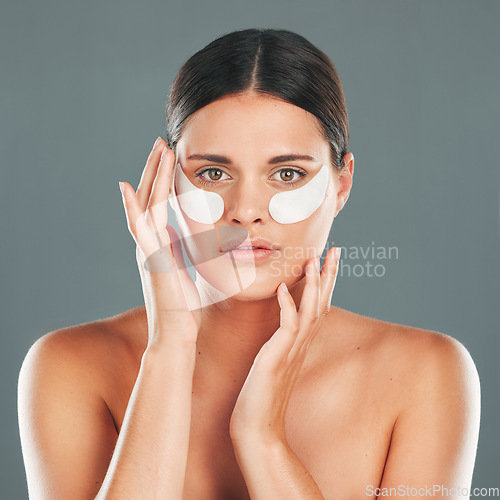 Image of Skincare, eyes patch and portrait of woman, beauty and dermatology on studio background. Female model, face and eye care gel for dark circles, body cosmetics and wellness of facial collagen treatment