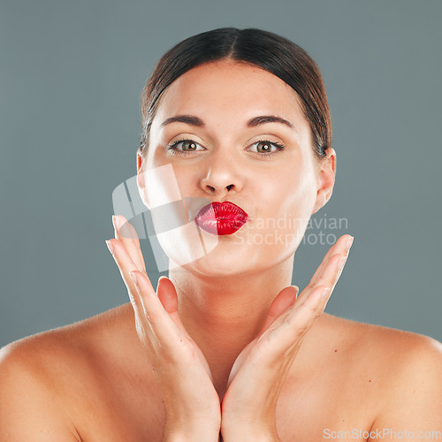 Image of Portrait, woman lips with lipstick and kiss face, red cosmetics and playful pout isolated on studio background. Makeup, beauty and skincare with cosmetic care, wellness and glow, facial and fun