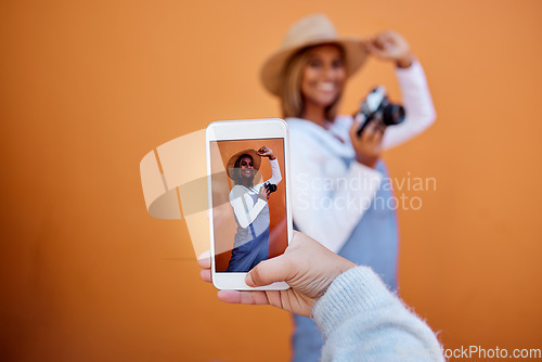 Image of Friends taking picture on a phone of woman isolated on wall background on social media or digital memory. Hand holding smartphone screen for happy profile of gen z, influencer person in summer mockup