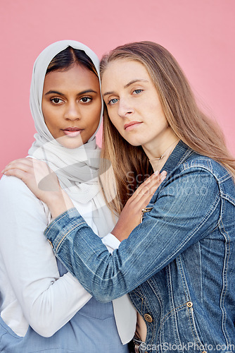 Image of LGBTQ, love and lesbian couple with embrace of sexuality isolated on a pink background. Freedom, hug and diversity in a relationship with women hugging for affection, romance and a date on a backdrop