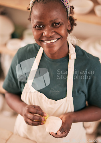 Image of Art, pottery and black woman in creative workshop with ceramics, sculpting and creativity with smile in portrait. Artist with handmade craft, pride and success with manufacturing and artistic process