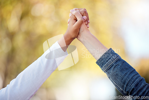 Image of Support, love and friends holding hands in the city for community, freedom and trust in Singapore. Care, collaboration and people with solidarity, romantic gesture and compassion together in town