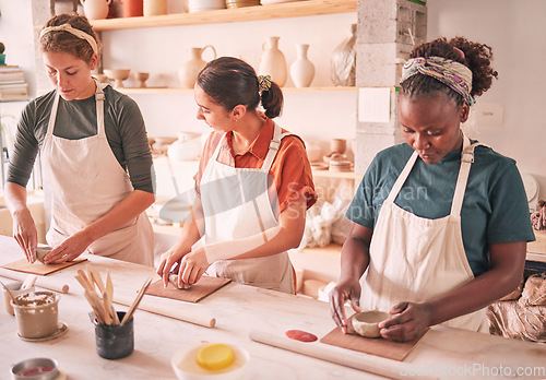 Image of Pottery sculpting and people row at workshop together for creative process, production and productivity. Focus, concentration and talent of interracial team of women in artistic workspace.