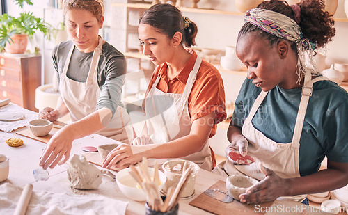 Image of Pottery class, ceramic workshop or group design sculpture mold, clay manufacturing or art product. Diversity people, retail sales store or startup small business owner, artist or studio women molding