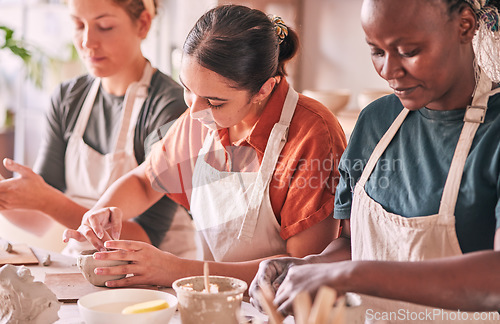 Image of Pottery class, creative workshop or people design sculpture mold, manufacturing or art product. Diversity women, ceramic retail store or startup small business owner, artist or studio group molding