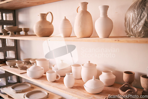 Image of Ceramics, dishes and pottery on shelf in studio, creative store and manufacturing startup. Clay products, background and shelves in workshop, small business and retail craft shop of stock production