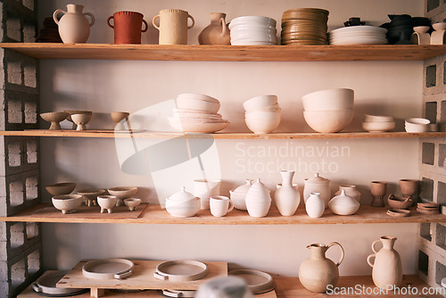 Image of Pottery backgrounds, ceramics and shelf in studio, creative store or manufacturing startup. Clay products, collection and display in workshop, small business and retail craft shop of stock production