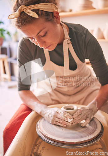 Image of Woman, sculpture artist and mud wheel for clay design, creative manufacturing and expert focus in studio workshop. Female, pottery process and small business designer working with ceramic craft