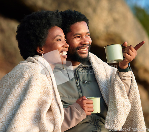 Image of Relax, pointing and camping with black couple and coffee for wake up, hiking and sunrise. Nature, calm and adventure with man and woman and blanket in nature for trekking, mountaineering or discovery