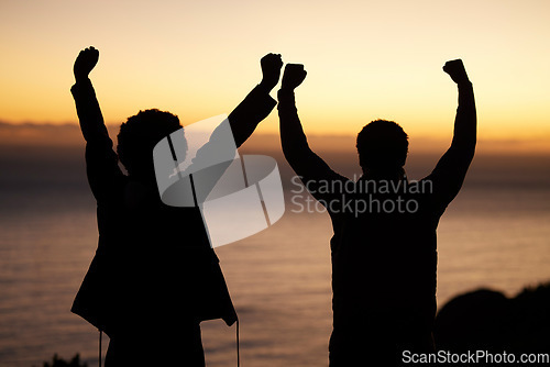 Image of Sunset, celebration and silhouette of couple at beach enjoying freedom, wellness and adventure outdoors. Victory, success and man with woman celebrate fitness goals, exercise and training achievement