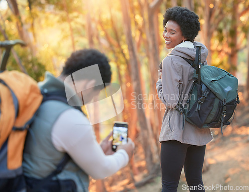 Image of Forest, phone photography or black couple hiking in nature for exercise, workout or training on holiday. Travel, pictures or African partners trekking or walking to hill on a fun outdoor adventure