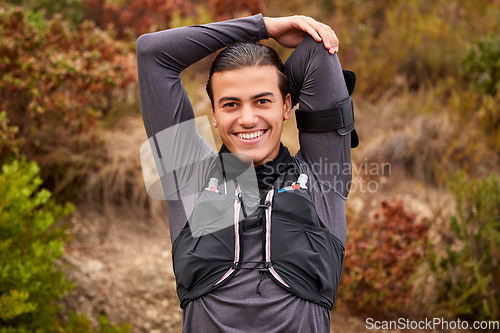 Image of Stretching, fitness and portrait of man in nature training, exercise or workout sports, runner or hiking. Happy, trekking and muscle warm up with smile of professional athlete for wellness in forest