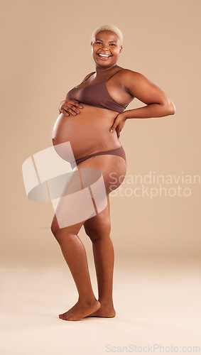 Image of Pregnant, portrait and black woman isolated on studio background for beauty, skincare and happy abdomen health. Underwear, body and african model or person pregnancy for wellness, care and self love