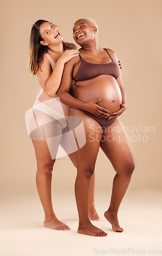 Image of Pregnant body, bonding or laughing women on studio background in health empowerment, baby support or community. Smile, happy and pregnancy friends in underwear in funny, comic or family planning joke