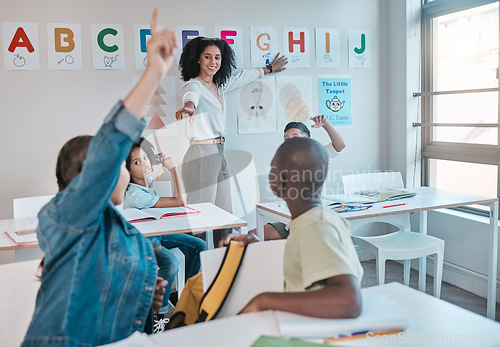 Image of Teacher, question and woman happy for education and teaching at school with kids learning the alphabet and answer quiz. Raised hands, learners and tutor helping a clever and smart classroom