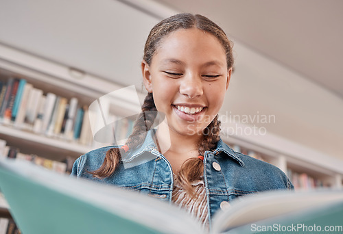 Image of Books, library or happy student reading a fun story for knowledge or development for learning growth. Scholarship, education or excited young high school girl smiles with pride studying information
