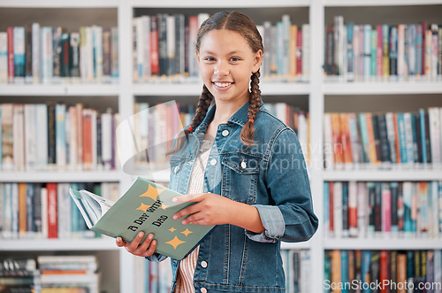 Image of Portrait, books or girl reading in library for knowledge, education or development for future growth. Scholarship, focus or young student with a happy smile studying or learning information at school