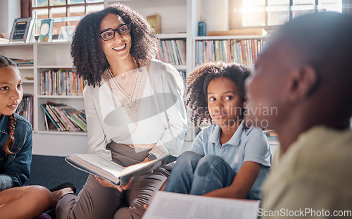 Image of Storytelling, teacher or students with talking in a library asking questions for learning development. Education, kids or children listening to a black woman speaking on fun books at school classroom