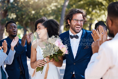 Image of Wedding crowd and applause to celebrate couple with happy, excited and cheerful smile. Interracial love and happiness of bride and groom at marriage event together with guests clapping.