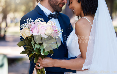 Image of Wedding, couple and hug with flower bouquet outdoor at marriage celebration event for bride and groom. Happy interracial man and woman at ceremony with trust, partnership and together for commitment