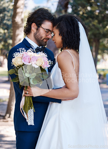 Image of Wedding, couple and marriage outdoor with commitment, trust and love with bride and groom in park. Life partner, married man and black woman with rose bouquet, content and interracial relationship