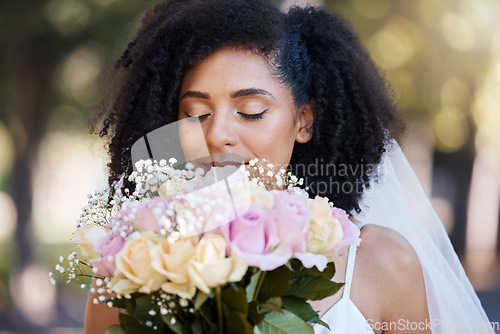 Image of Eyes closed, bride and black woman with flowers at wedding outdoors. Face, marriage and beauty of female smelling floral bouquet of roses to celebrate at party, ceremony event or love celebration