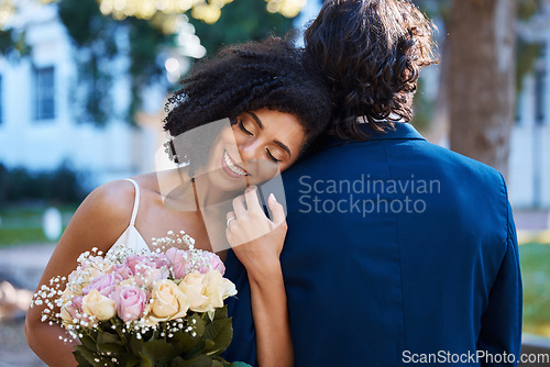 Image of Wedding, happy bride and couple outdoor for marriage celebration event together with commitment. Married interracial man and woman at ceremony with trust, partnership and a hug with flower bouquet