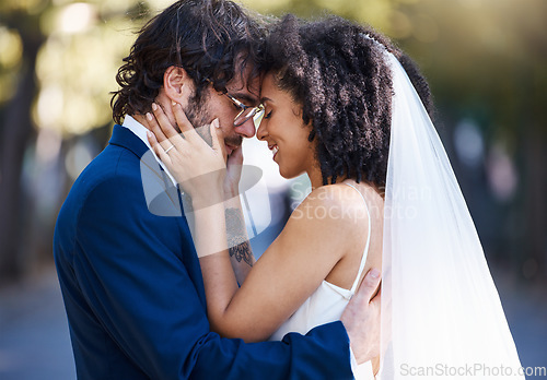 Image of Love, happy couple and wedding hug outdoor at marriage celebration event with commitment. Interracial man and woman together at park with trust, partnership and gratitude with a touch on the face