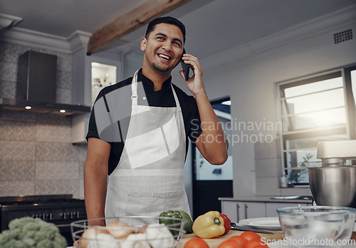 Image of Man, happy phone call and cooking in kitchen for healthy nutrition, food diet and organic vegetables salad. Young male, chef happiness lifestyle and smile for smartphone call or cook dinner in home