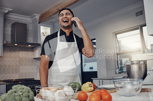Image of Man, phone call and laughing or cooking in kitchen for healthy nutrition, food diet and organic vegetables salad. Young male, chef happiness and smile for smartphone call or cook dinner in home
