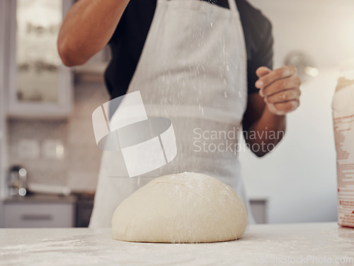 Image of Chef man and flour sprinkle on dough for baking preparation work and process at culinary counter. Restaurant worker in professional kitchen preparing wheat bread, cake or pizza recipe.