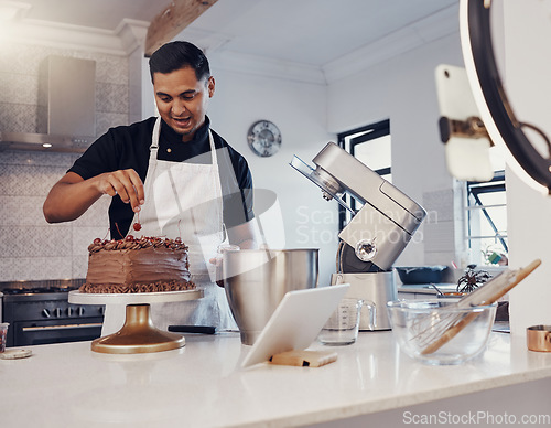 Image of Man, vlog and baking chocolate cake in kitchen, live streaming and recording a dessert tutorial on social media. Happy chef, digital content creator or food influencer filming a virtual cooking class