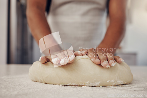 Image of Chef hands and dough press for baking preparation work, production and process of man at culinary counter. Restaurant worker in professional kitchen preparing bread, cake or pizza recipe.