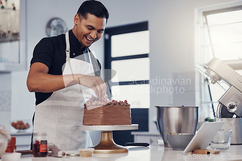 Image of Chef, baking and cake with chocolate in a kitchen by a happy man preparing a sweet desert or a birthday. Decoration, baker or cook with a small business smiling and cooking dessert at a bakery