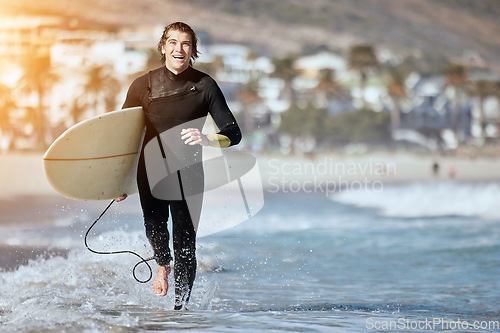 Image of Portrait, man with surfboard and running on beach, happiness and summer vacation for weekend break. Surfer, male and athlete run, seaside holiday and adventure with smile, sunshine and water sport