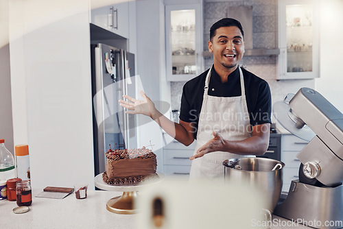 Image of Man, chef and talking in kitchen on vlog, live streaming and recording a cake dessert tutorial on social media. Happy baker, digital content creator or food influencer filming a virtual cooking class