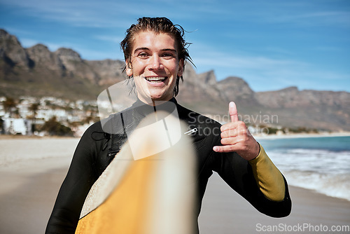 Image of Shaka hand sign, beach and surfer with surfboard for fitness, fun and adventure on vacation. Sports, travel and portrait of man with chill gesture for surfing by the ocean on holiday in South Africa.