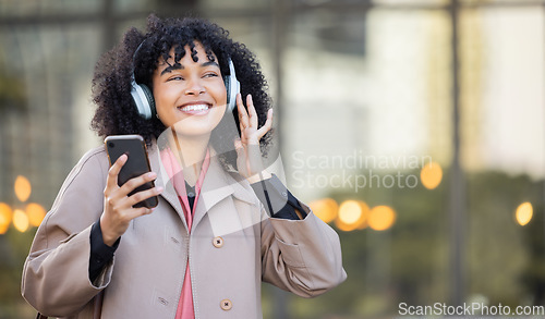 Image of Smile, happy or black woman with music in city, radio or podcast on headphones walking in street or to office. Startup, employee or worker travel on smartphone, 5g network or audio in New York