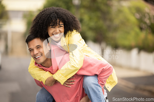 Image of Black couple, smile and piggyback of young people with love, care and freedom in a street. Urban, happy and free woman and man together with a holiday and happiness hug loving summer fun outdoor